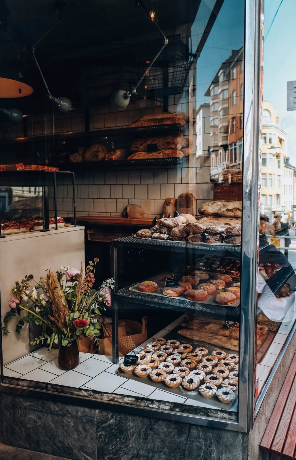 A bakery window full of fresh pastries and bread