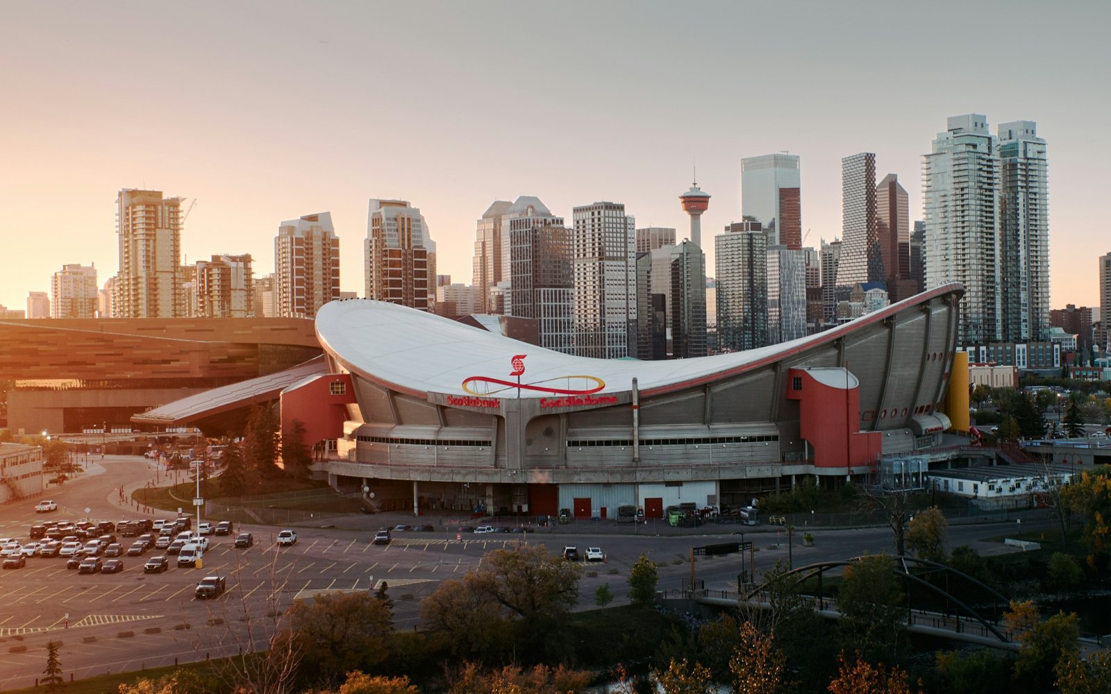 The Saddledome and the downtown Calgary skyline at sunset