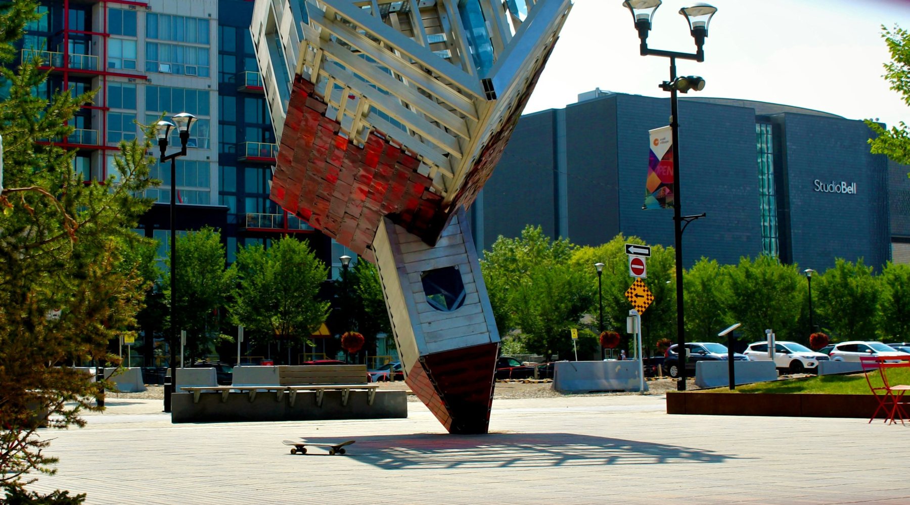 The upside-down church sculpture in East Village, with Studio Bell behind it