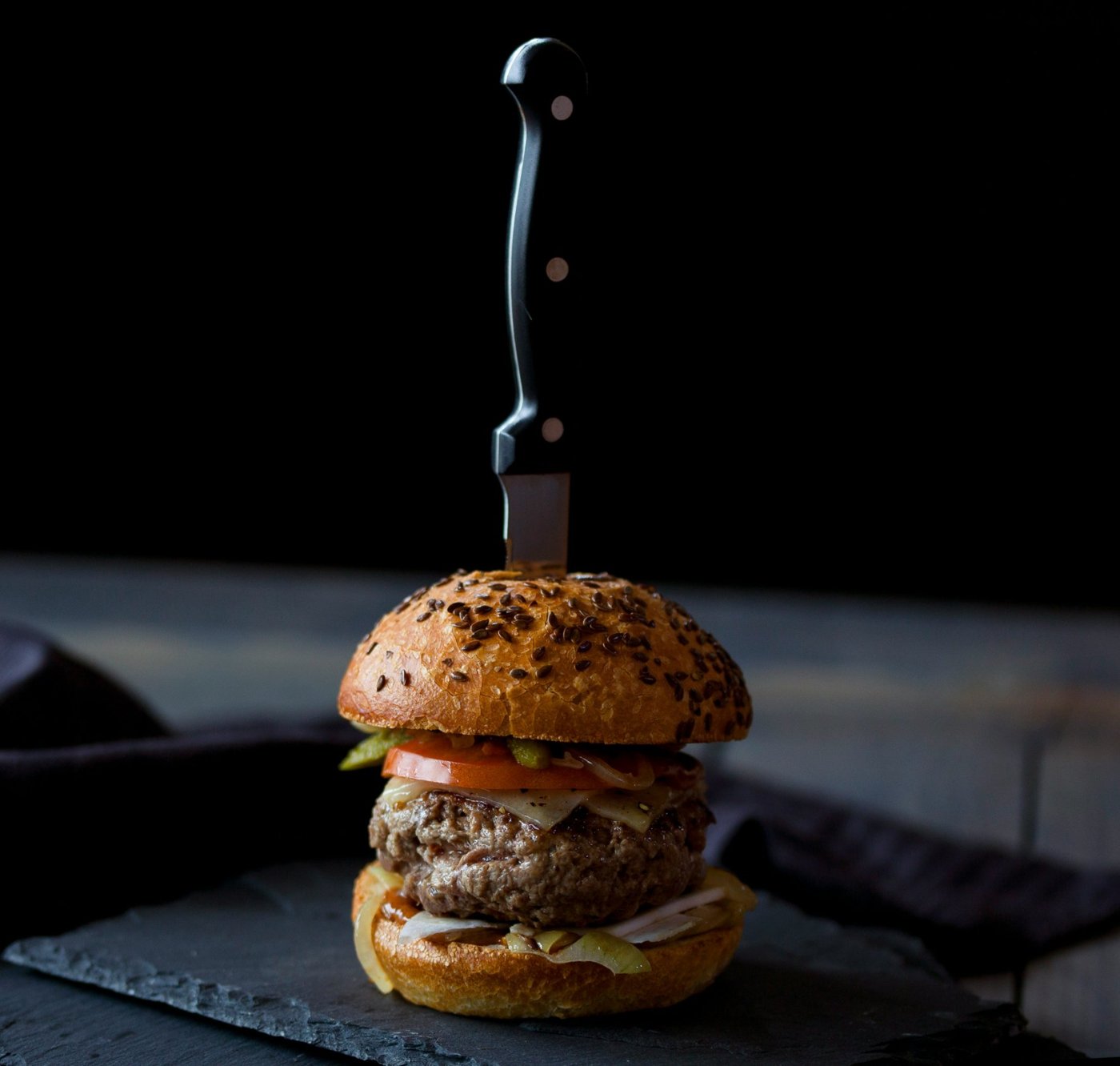 A burger on a slate board